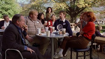 Movie still from “Road Trip” (2000), directed by Todd Phillips – A group of people sitting at a table with drinks; Wide shot, High angle