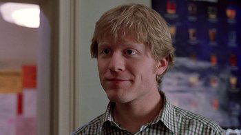 Movie still from “Road Trip” (2000), directed by Todd Phillips – A person wearing a plaid shirt; Close Up shot, Over the shoulder angle