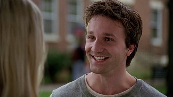 Movie still from “Road Trip” (2000), directed by Todd Phillips – A person smiling; Close Up shot, Over the shoulder angle