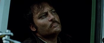 Movie still from “Road Games” (1981), directed by Richard Franklin – A person with a mustache; Close Up shot, Low angle