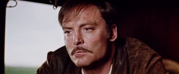 Movie still from “Road Games” (1981), directed by Richard Franklin – A person with a mustache; Close Up shot, Low angle