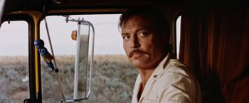 Movie still from “Road Games” (1981), directed by Richard Franklin – A person in a vehicle; Close Up shot, Low angle