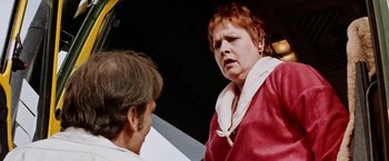 Movie still from “Road Games” (1981), directed by Richard Franklin – An older man and a younger woman talking to each other; Close Up shot, Low angle