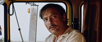 Movie still from “Road Games” (1981), directed by Richard Franklin – A person in a car window; Close Up shot, Low angle