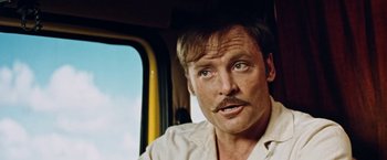 Movie still from “Road Games” (1981), directed by Richard Franklin – A person with a mustache; Close Up shot, Low angle