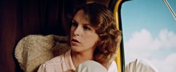 Movie still from “Road Games” (1981), directed by Richard Franklin – A person sitting in a vehicle; Close Up shot, Low angle