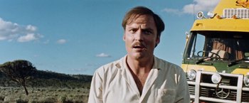 Movie still from “Road Games” (1981), directed by Richard Franklin – A person with a mustache; Close Up shot, Low angle