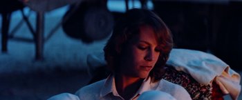 Movie still from “Road Games” (1981), directed by Richard Franklin – A person wearing a white shirt; Close Up shot, Low angle