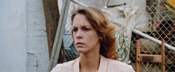 Movie still from “Road Games” (1981), directed by Richard Franklin – A person with long hair; Close Up shot, Low angle