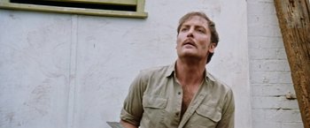 Movie still from “Road Games” (1981), directed by Richard Franklin – A person holding a knife; Close Up shot, Low angle