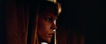 Movie still from “Road Games” (1981), directed by Richard Franklin – A person looking out a window; Close Up shot, Low angle