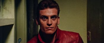 Movie still from “Road Games” (1981), directed by Richard Franklin – A person wearing a red jacket; Close Up shot, Low angle