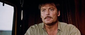 Movie still from “Road Games” (1981), directed by Richard Franklin – A person with a mustache; Close Up shot, Low angle