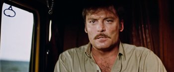 Movie still from “Road Games” (1981), directed by Richard Franklin – A person with a mustache; Close Up shot, Low angle