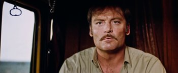 Movie still from “Road Games” (1981), directed by Richard Franklin – A person with a mustache; Close Up shot, Low angle