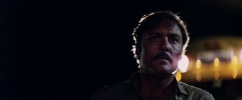 Movie still from “Road Games” (1981), directed by Richard Franklin – A person looking at the camera; Close Up shot, Low angle
