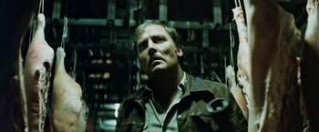 Movie still from “Road Games” (1981), directed by Richard Franklin – A person wearing a shirt and jacket; Close Up shot, Low angle