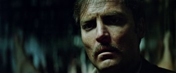 Movie still from “Road Games” (1981), directed by Richard Franklin – A person with a mustache; Close Up shot, Low angle