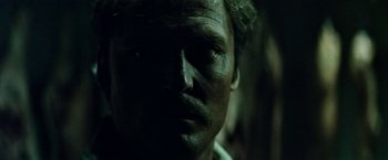Movie still from “Road Games” (1981), directed by Richard Franklin – A man's face in the dark; Close Up shot, Low angle