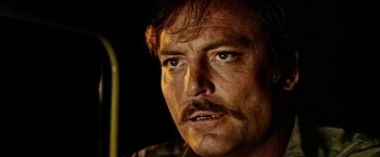 Movie still from “Road Games” (1981), directed by Richard Franklin – A person with a mustache; Close Up shot, Low angle