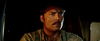 Movie still from “Road Games” (1981), directed by Richard Franklin – A person with a mustache; Close Up shot, Low angle
