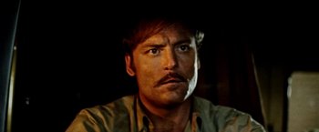 Movie still from “Road Games” (1981), directed by Richard Franklin – A person with a mustache; Close Up shot, Low angle