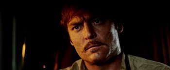 Movie still from “Road Games” (1981), directed by Richard Franklin – A person with a mustache; Close Up shot, Low angle