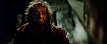 Movie still from “Road Games” (1981), directed by Richard Franklin – A person wearing a jacket; Close Up shot, Low angle