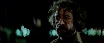 Movie still from “Road Games” (1981), directed by Richard Franklin – A person with a beard; Close Up shot, Low angle
