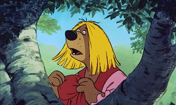 Movie still from “Robin Hood” (1973), directed by David Hand – A cartoon of a dog with long blond hair; Close Up shot, Low angle