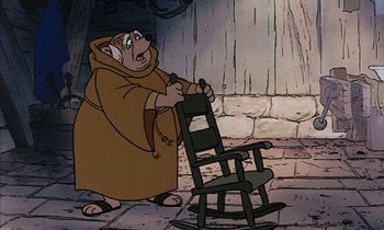 Movie still from “Robin Hood” (1973), directed by David Hand – A cartoon of an old man in a monk's robe and a rocking chair; Medium shot, High angle