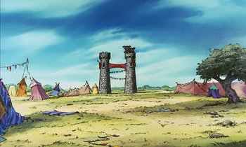 Movie still from “Robin Hood” (1973), directed by David Hand – Two towers in the middle of a field with tents in the background; Extreme Wide shot, Low angle