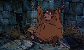 Movie still from “Robin Hood” (1973), directed by David Hand – A cartoon of a bear chained up to a wall; Medium shot, High angle