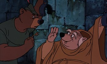 Movie still from “Robin Hood” (1973), directed by David Hand – A cartoon of a bear and a man in a brown robe; Close Up shot, Overhead angle