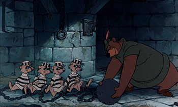Movie still from “Robin Hood” (1973), directed by David Hand – A group of bears in chains with a man looking on from the ground; Wide shot, Overhead angle