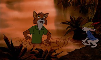 Movie still from “Robin Hood” (1973), directed by David Hand – A cartoon picture of a man in a green shirt; Medium shot, High angle