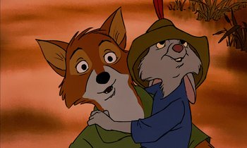 Movie still from “Robin Hood” (1973), directed by David Hand – Two cartoon characters one of which is hugging another; Close Up shot, Low angle