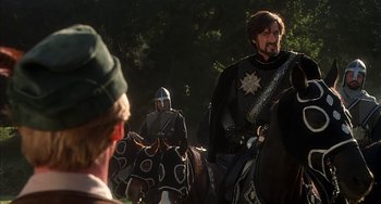 Movie still from “Robin Hood: Men in Tights” (1993), directed by Mel Brooks – Two men in medieval garb on horseback in a forest; Medium shot, Over the shoulder angle