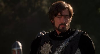 Movie still from “Robin Hood: Men in Tights” (1993), directed by Mel Brooks – A person with a beard; Close Up shot, Over the shoulder angle