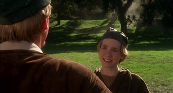 Movie still from “Robin Hood: Men in Tights” (1993), directed by Mel Brooks – A young man and woman in a field; Close Up shot, Over the shoulder angle