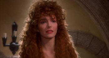 Movie still from “Robin Hood: Men in Tights” (1993), directed by Mel Brooks – A person with long red hair; Close Up shot, Over the shoulder angle