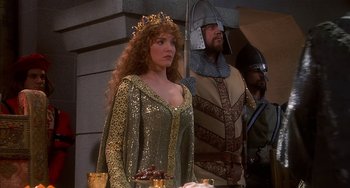 Movie still from “Robin Hood: Men in Tights” (1993), directed by Mel Brooks – A woman dressed as a medieval princess and a man dressed as a knight; Medium shot, Over the shoulder angle
