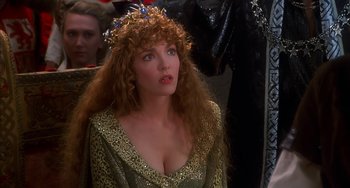 Movie still from “Robin Hood: Men in Tights” (1993), directed by Mel Brooks – A person with long hair wearing a dress; Close Up shot, Over the shoulder angle