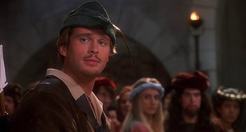 Movie still from “Robin Hood: Men in Tights” (1993), directed by Mel Brooks – A group of people dressed up in costumes; Close Up shot, Over the shoulder angle