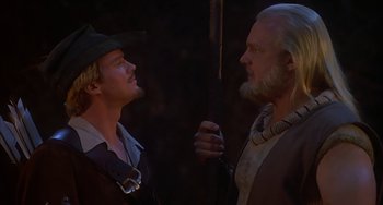 Movie still from “Robin Hood: Men in Tights” (1993), directed by Mel Brooks – Two men in medieval garb facing each other; Close Up shot, Over the shoulder angle