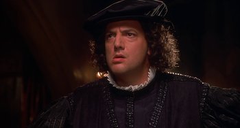Movie still from “Robin Hood: Men in Tights” (1993), directed by Mel Brooks – A person wearing a hat; Close Up shot, Low angle