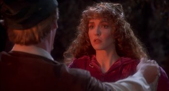 Movie still from “Robin Hood: Men in Tights” (1993), directed by Mel Brooks – A woman with curly red hair is looking at a man; Close Up shot, Over the shoulder angle