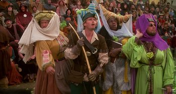 Movie still from “Robin Hood: Men in Tights” (1993), directed by Mel Brooks – A group of people dressed up in costumes; Medium shot, High angle