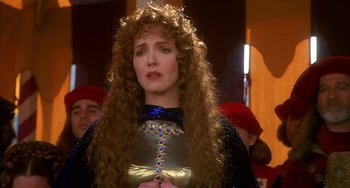 Movie still from “Robin Hood: Men in Tights” (1993), directed by Mel Brooks – A person with long curly hair; Close Up shot, Over the shoulder angle