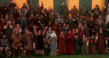 Movie still from “Robin Hood: Men in Tights” (1993), directed by Mel Brooks – A group of people dressed in medieval costumes; Wide shot, High angle